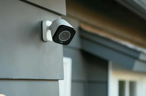 High-resolution security camera installed on a home exterior, providing surveillance and monitoring capabilities.
