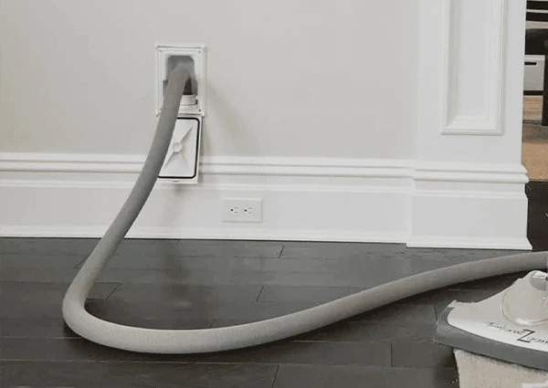 Central vacuum system outlet installed in a Boca Raton, FL, home, providing efficient cleaning solutions.