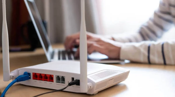 Technician installing a home internet router for reliable connectivity