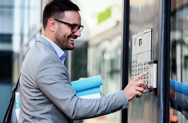 Technician installing a modern intercom system for enhanced communication and security.