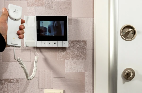 Modern intercom system with video screen installed at the entrance of a Boca Raton, FL, property, enhancing security.