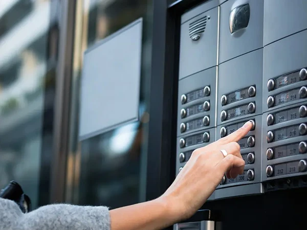Intercom system installed at the entrance of a building for secure communication.