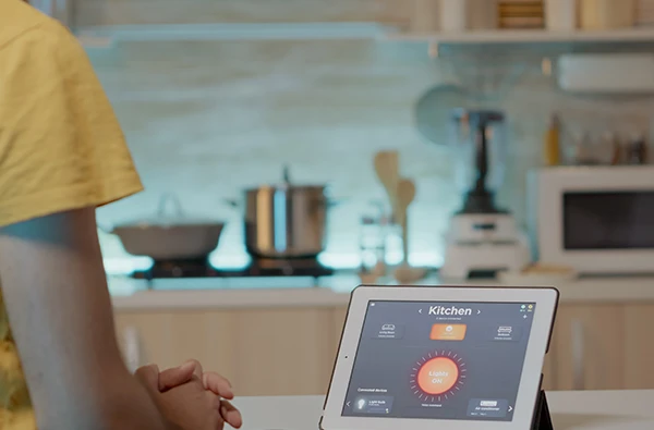 Smart home automation system controlled via tablet in a modern Boca Raton, FL, home, showcasing lighting and temperature control