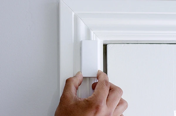Smart sensor installed on a window for home security automation