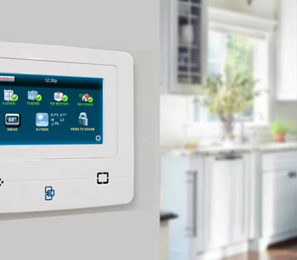 Touchscreen control panel for a smart home security system in a modern kitchen