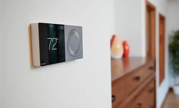 Smart thermostat installation service showing digital temperature in Royal Palm Beach FL.