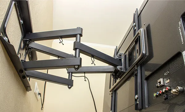 Adjustable and sturdy TV bracket mounting arm installed on a wall, demonstrating expert TV bracket installation services in Royal Palm Beach, FL.